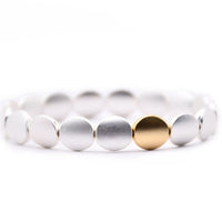 Silver Disc Bracelet with One Gold Disc